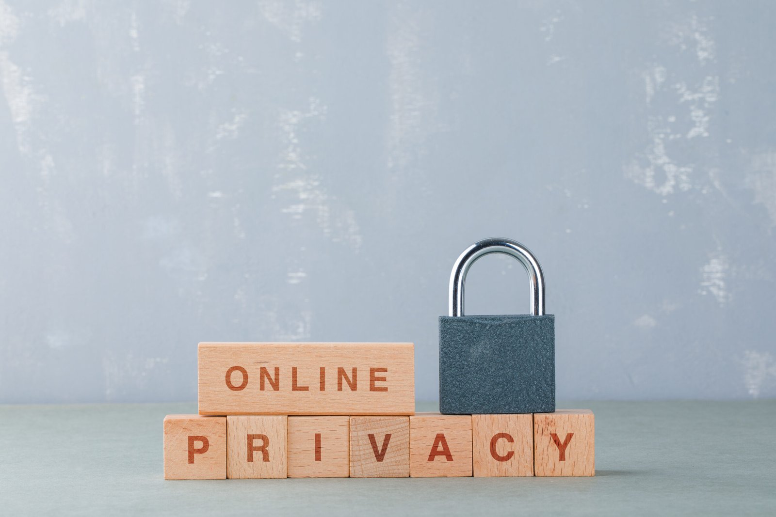 Privacy Policy data privacy concept with wooden blocks with words, lock on it on sage color background side view. horizontal image